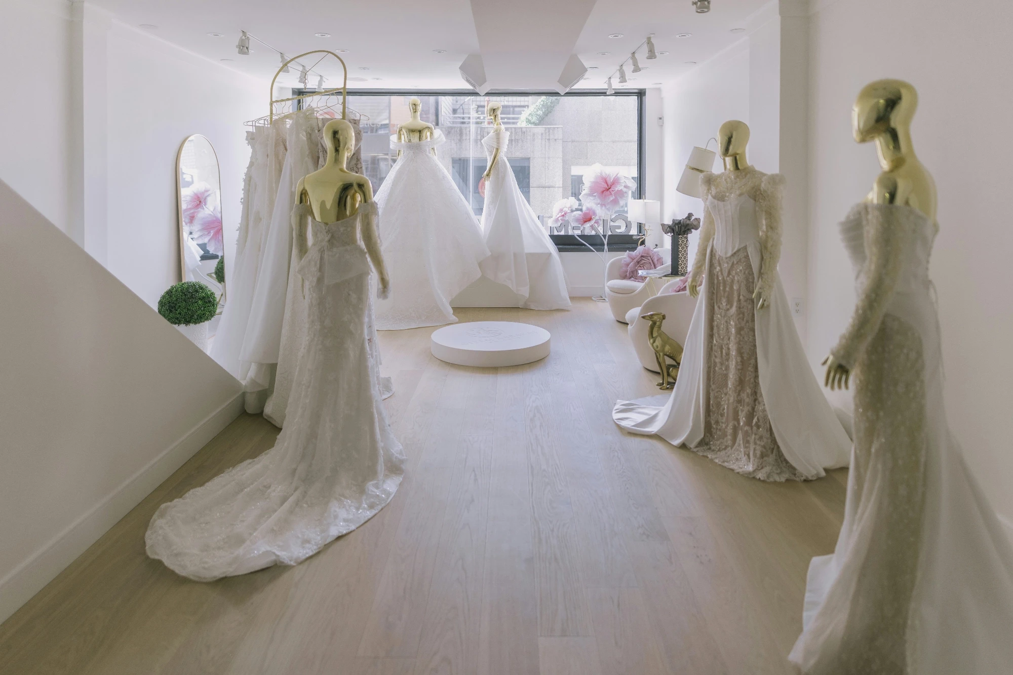 a rack of wedding dresses in a bridal shop