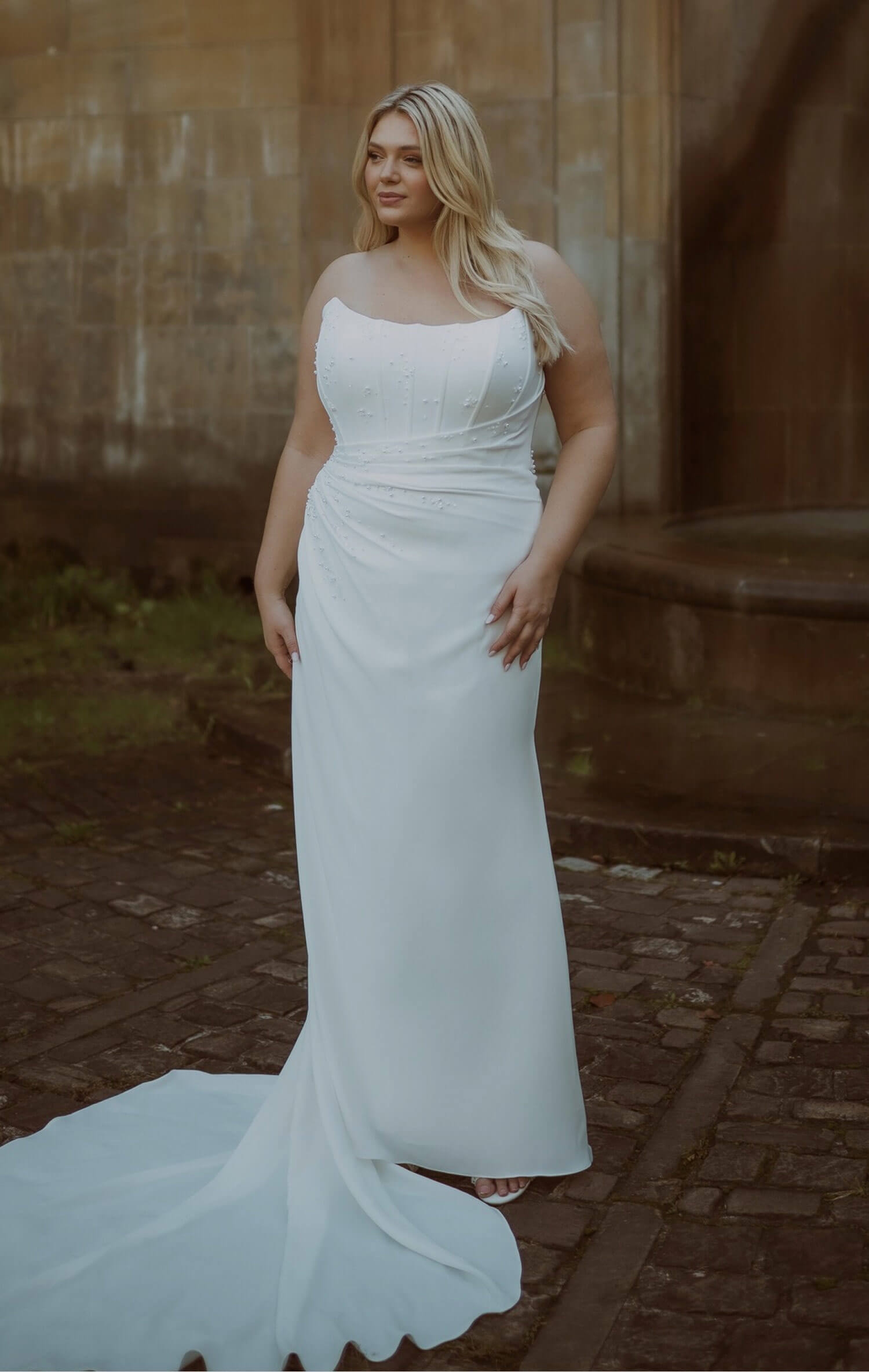 Model wearing a bridal whate dress. Mobile image