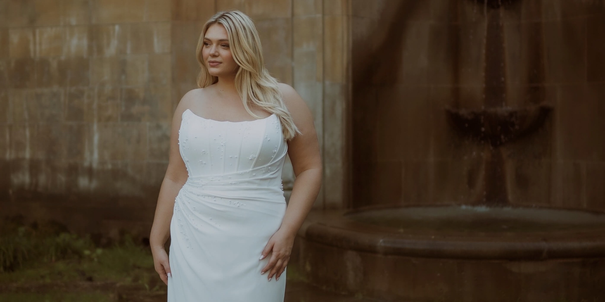 Model wearing a bridal whate dress